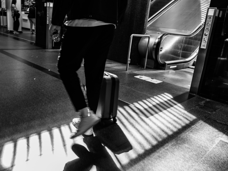 UnitedUs team member moving through a train station