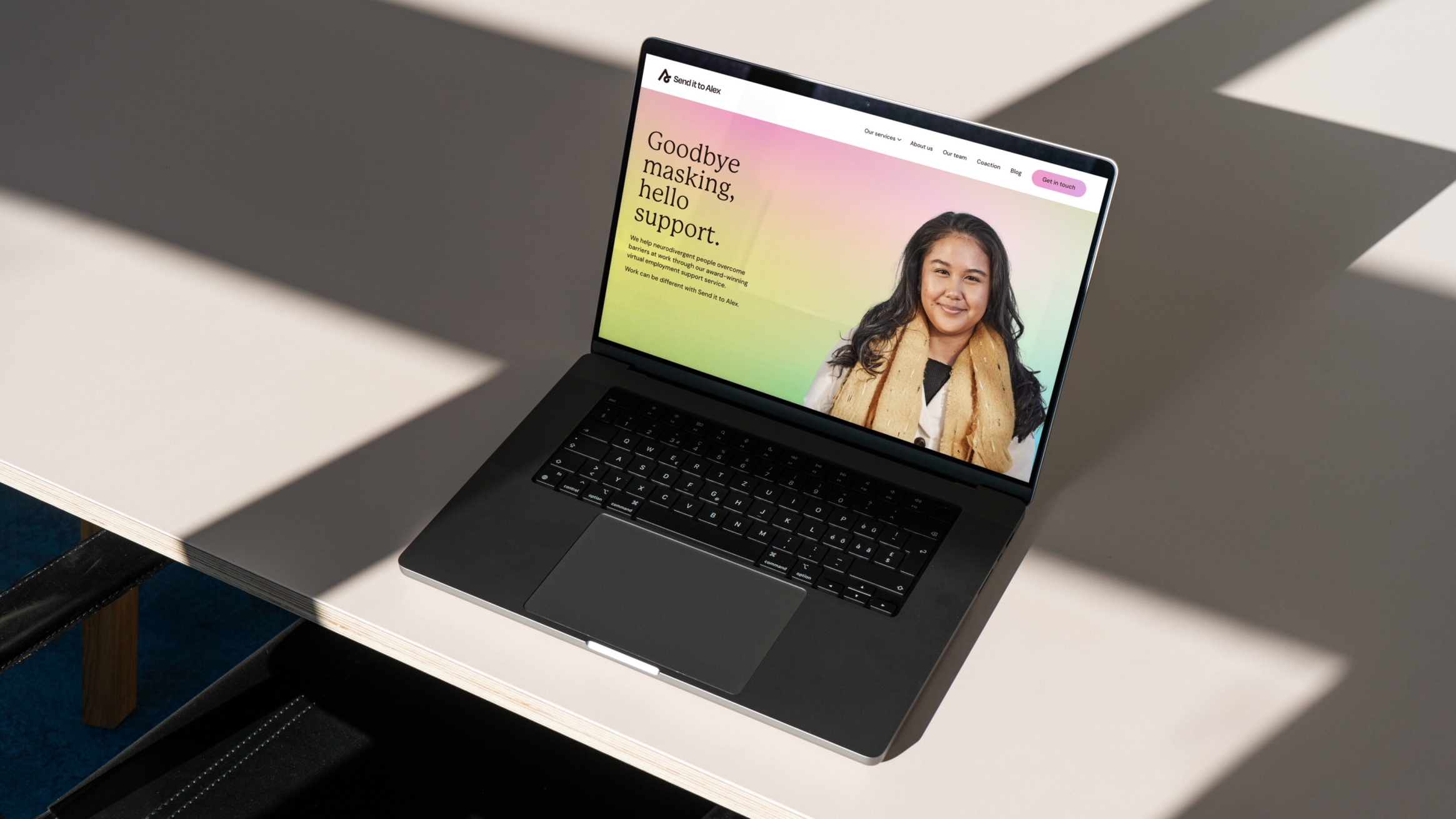 laptop showing the hero image and messaging on the website.