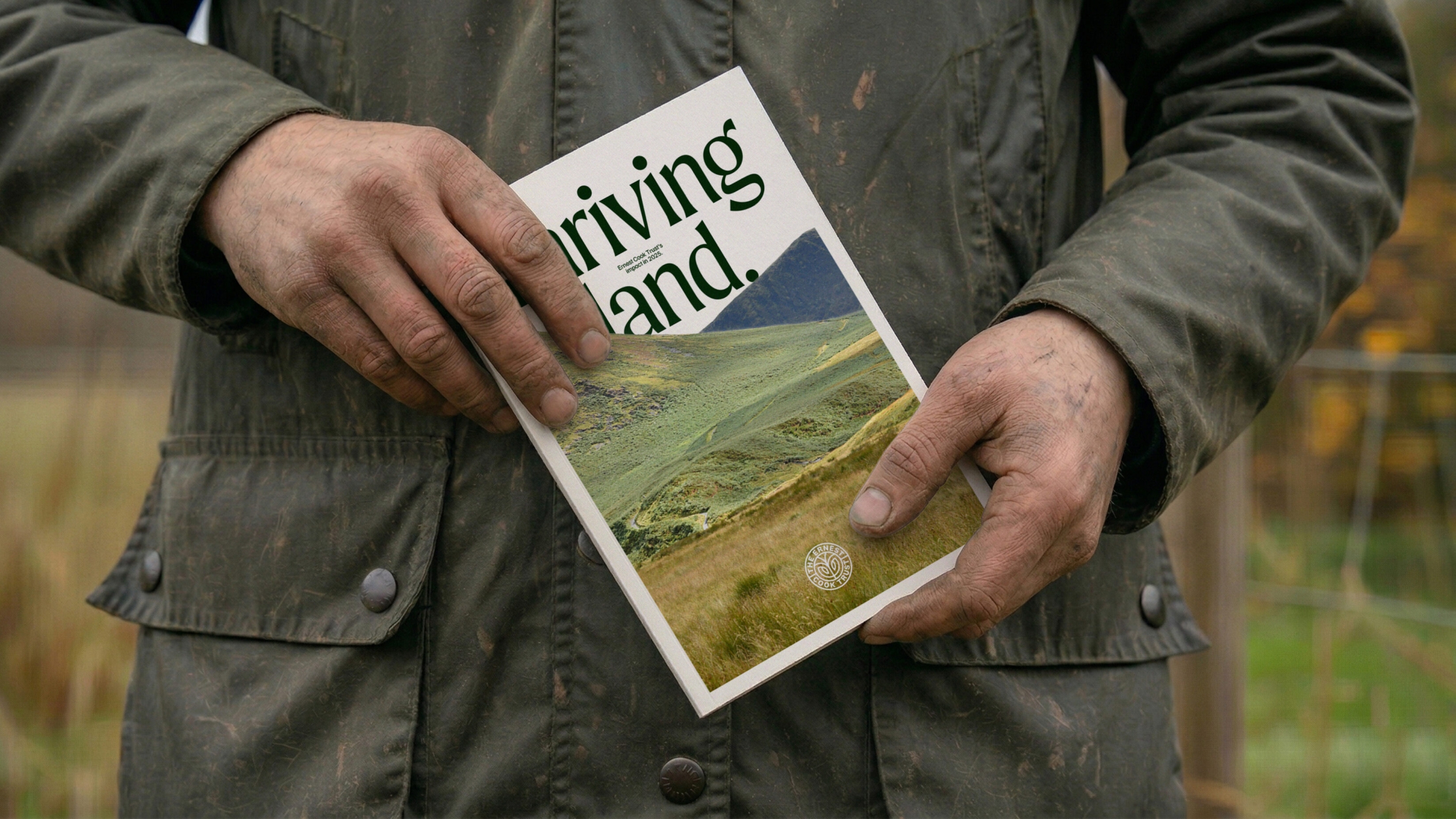 A farmer holding a printed report docuemnt.